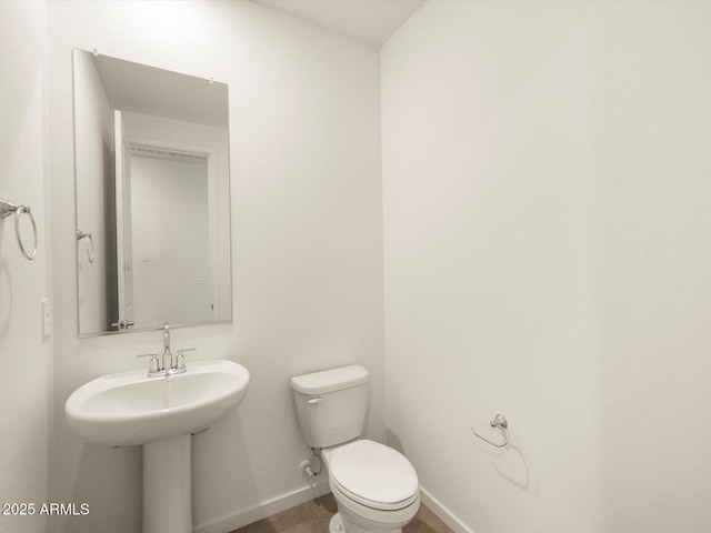 bathroom featuring toilet