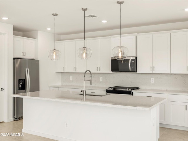 kitchen featuring white cabinetry, sink, an island with sink, and appliances with stainless steel finishes