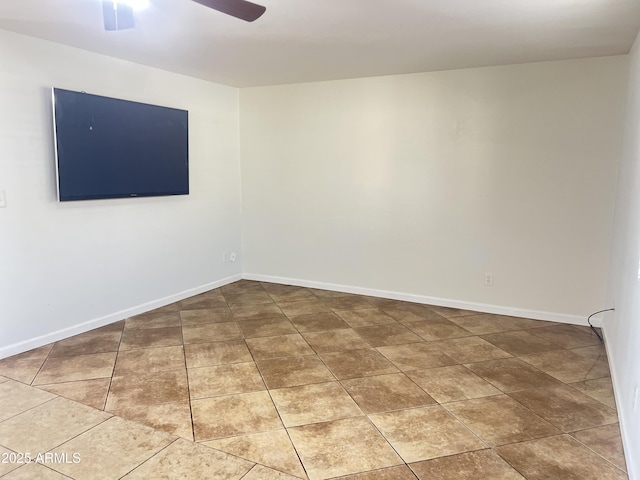 tiled empty room with ceiling fan