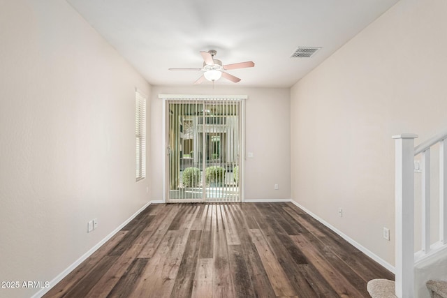 unfurnished room with dark hardwood / wood-style floors and ceiling fan