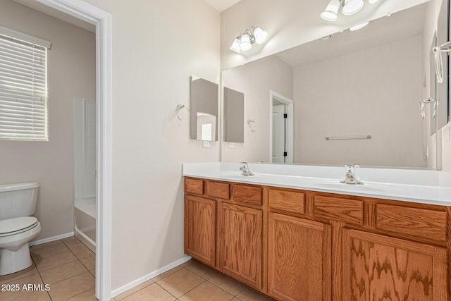 bathroom featuring vanity, toilet, and tile patterned flooring