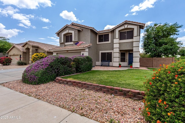 mediterranean / spanish-style house with stucco siding, a tiled roof, and an attached garage