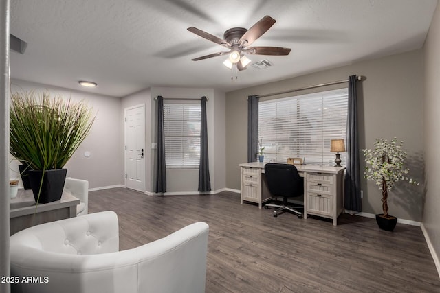 office space with a ceiling fan, dark wood finished floors, and baseboards