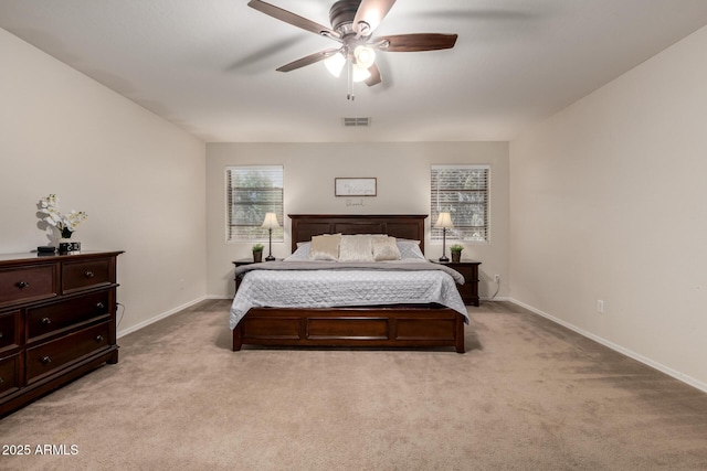 bedroom featuring light carpet, baseboards, and a ceiling fan