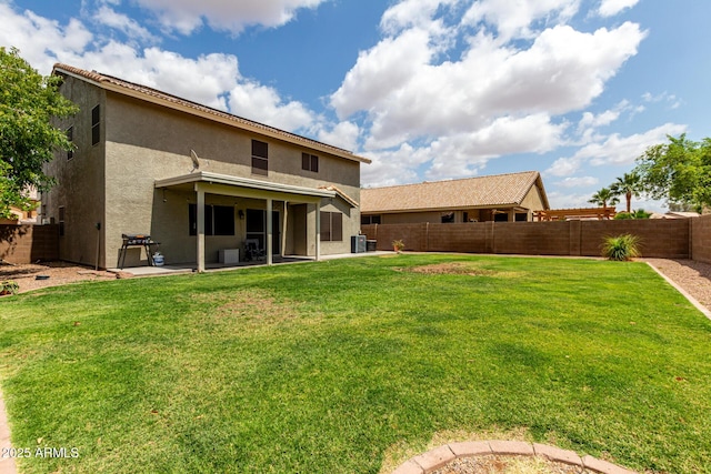 back of house featuring a patio area, central air condition unit, and stucco siding