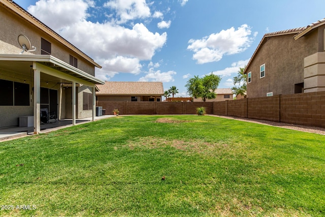 view of yard with a patio and central AC