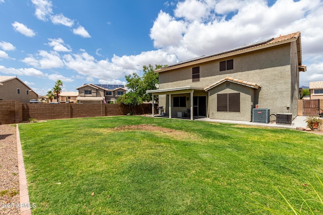 rear view of house featuring stucco siding, a patio, and central air condition unit
