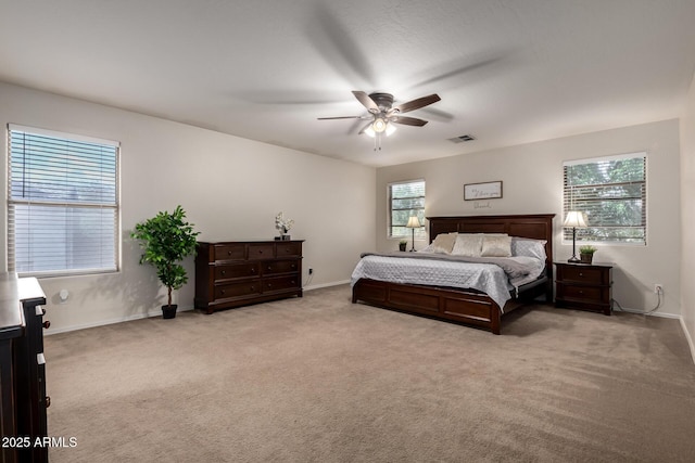 bedroom featuring carpet floors, baseboards, and a ceiling fan