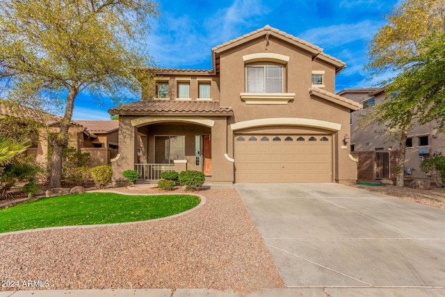 322 E Caribbean Dr, Casa Grande, AZ 85122 - mediterranean / spanish house with a porch, stucco siding, driveway, an attached garage, and a tile roof