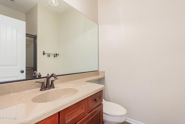 322 E Caribbean Dr, Casa Grande, AZ 85122 - bathroom featuring toilet, vanity, and baseboards