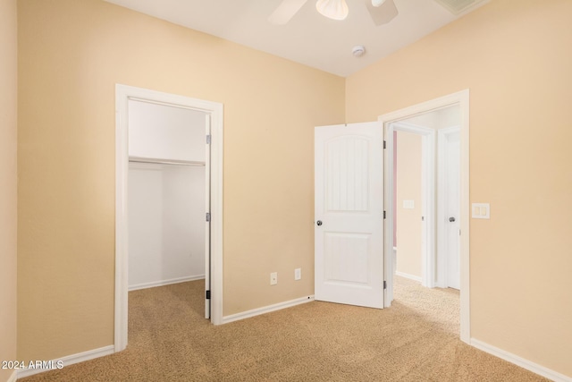 322 E Caribbean Dr, Casa Grande, AZ 85122 - unfurnished bedroom featuring carpet, a spacious closet, a closet, baseboards, and ceiling fan