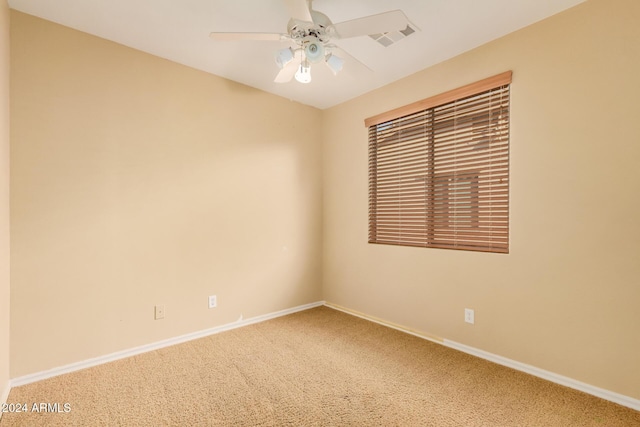 322 E Caribbean Dr, Casa Grande, AZ 85122 - unfurnished room with light carpet, baseboards, and ceiling fan