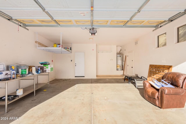 322 E Caribbean Dr, Casa Grande, AZ 85122 - garage featuring water heater and a garage door opener