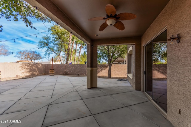 322 E Caribbean Dr, Casa Grande, AZ 85122 - fenced backyard featuring ceiling fan and a patio area