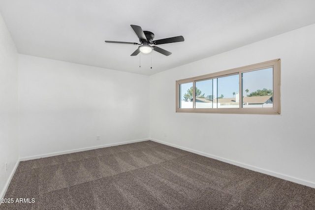 unfurnished room featuring ceiling fan and carpet flooring