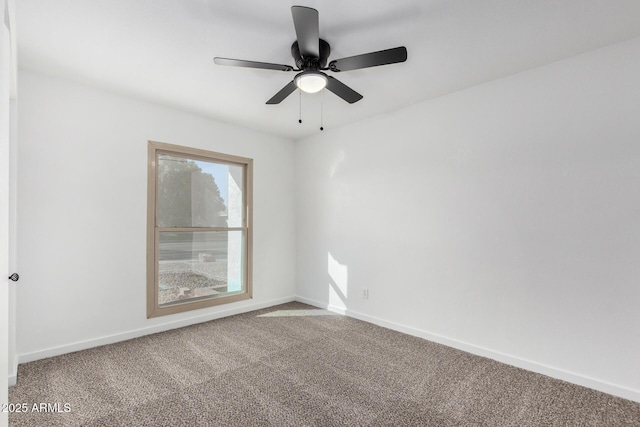 empty room with ceiling fan and carpet flooring