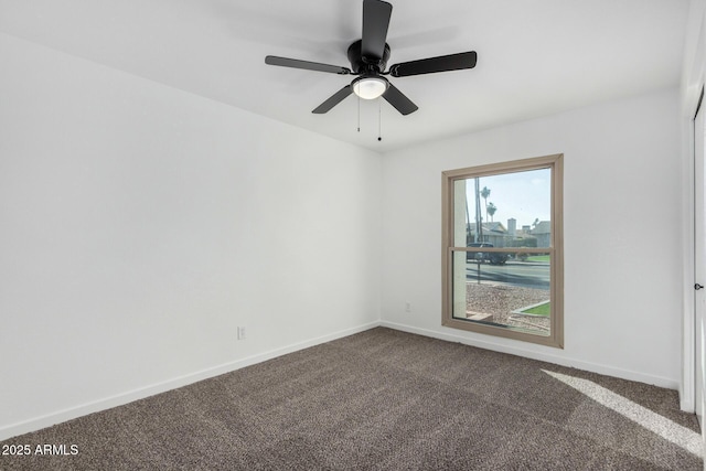 spare room with carpet floors and ceiling fan