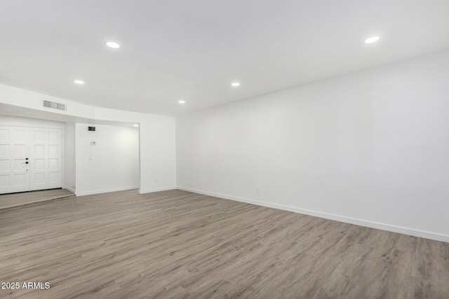 spare room with light wood-type flooring