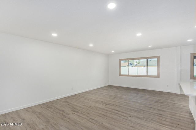 unfurnished room featuring hardwood / wood-style floors