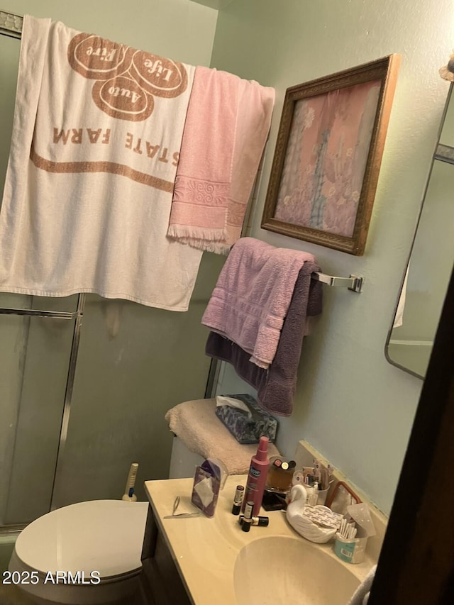 9033 N 15th Dr, Phoenix, AZ 85021 - bathroom featuring toilet, vanity, and an enclosed shower