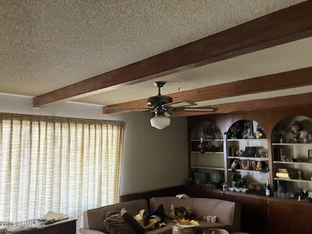 9033 N 15th Dr, Phoenix, AZ 85021 - living area with beam ceiling, a textured ceiling, and a ceiling fan