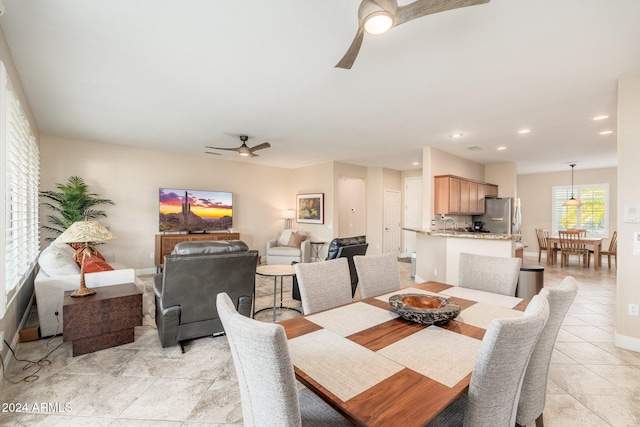 dining room featuring ceiling fan and light tile patterned flooring