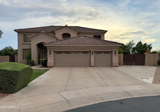 mediterranean / spanish house with a garage