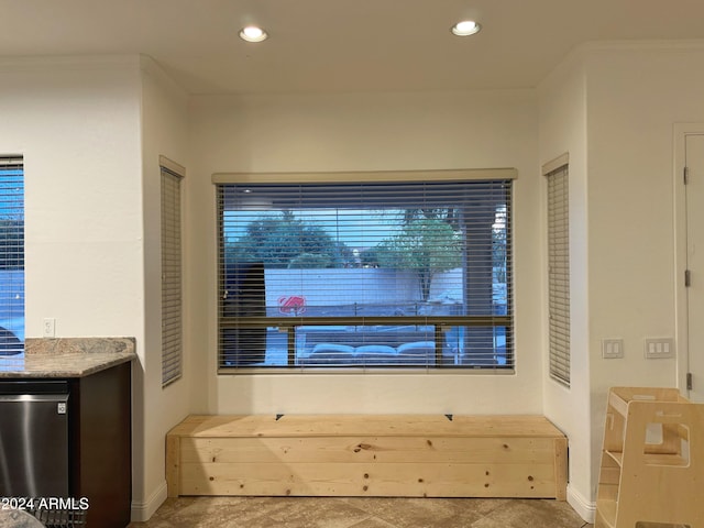 interior space featuring fridge and ornamental molding