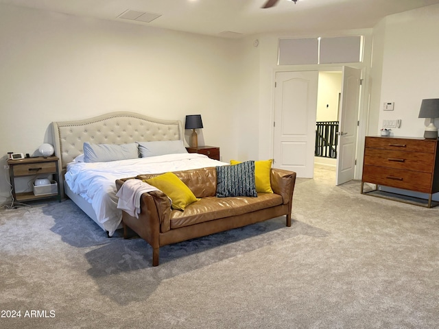 bedroom with light colored carpet