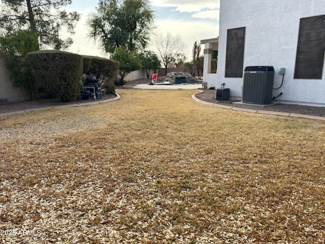 view of yard featuring central air condition unit