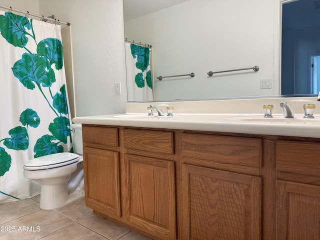 bathroom with toilet, vanity, tile patterned floors, and a shower with shower curtain