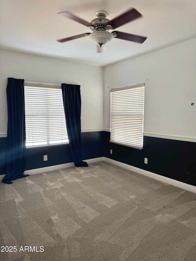 unfurnished room with carpet flooring and ceiling fan