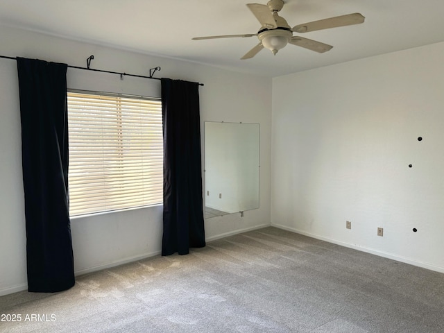 spare room with light carpet and ceiling fan