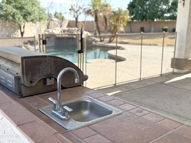 view of pool with sink