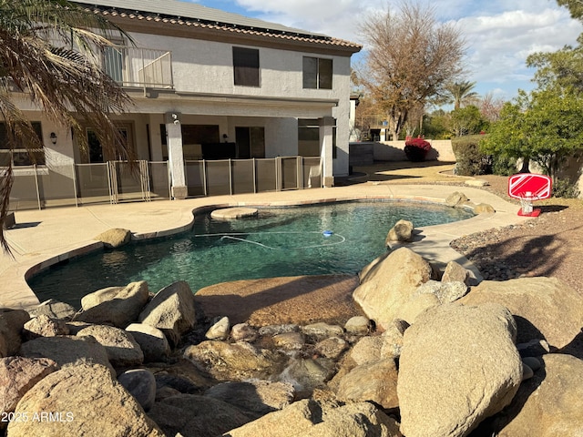 view of swimming pool with a patio