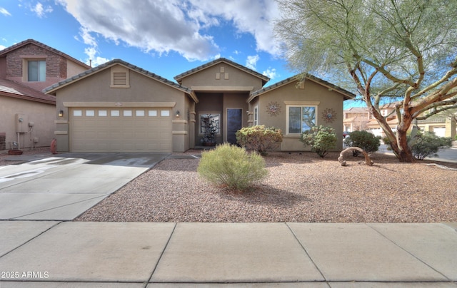 view of front of house featuring driveway, a garage, central AC unit, a tile roof, and stucco siding