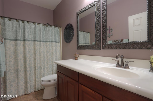 bathroom featuring curtained shower, vanity, toilet, and tile patterned floors