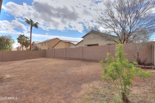view of yard with a fenced backyard