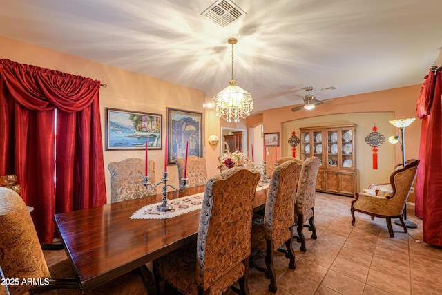 dining area with a chandelier, visible vents, and light tile patterned floors