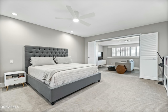 bedroom with ceiling fan and carpet floors