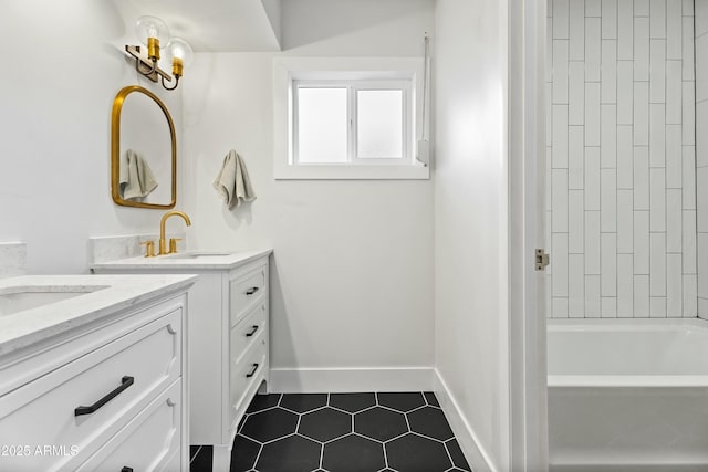 bathroom featuring vanity, bathtub / shower combination, and tile patterned floors