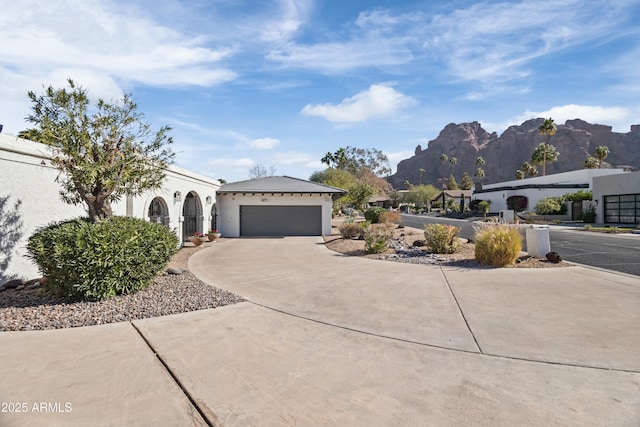 view of front of house with a mountain view and a garage