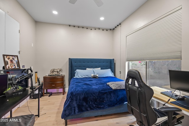 bedroom featuring light wood-type flooring and ceiling fan