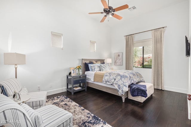 bedroom with ceiling fan and dark hardwood / wood-style flooring