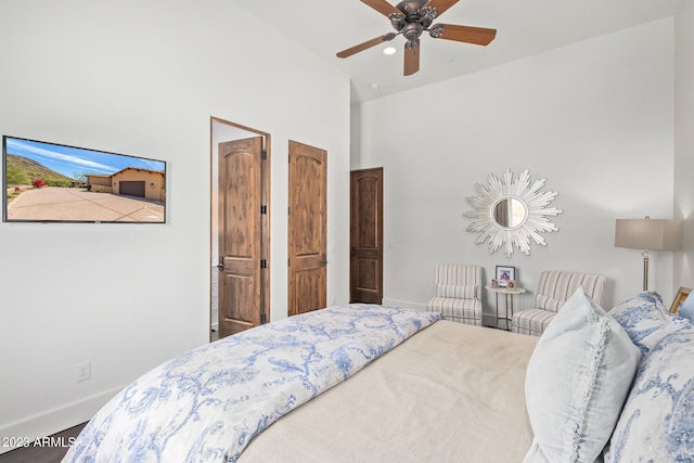 bedroom featuring ceiling fan and lofted ceiling