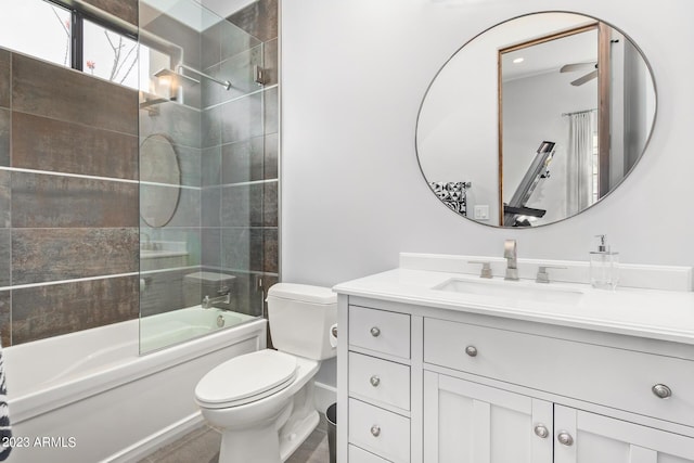 full bathroom featuring vanity, toilet, and shower / bath combination with glass door