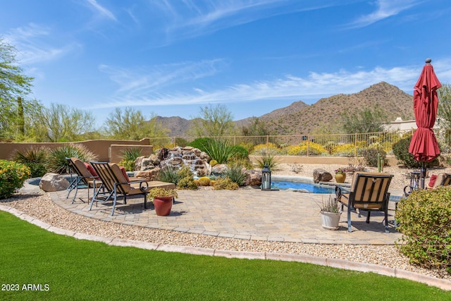 view of patio / terrace with a mountain view