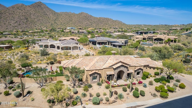 drone / aerial view featuring a mountain view