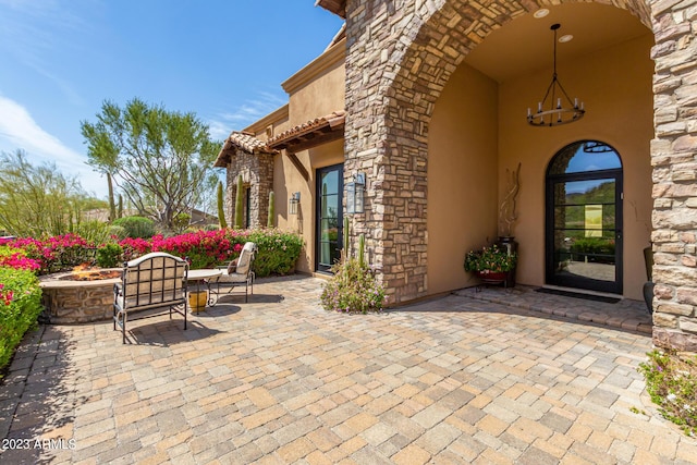 view of patio with a fire pit