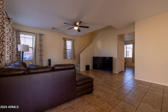 tiled living room featuring ceiling fan